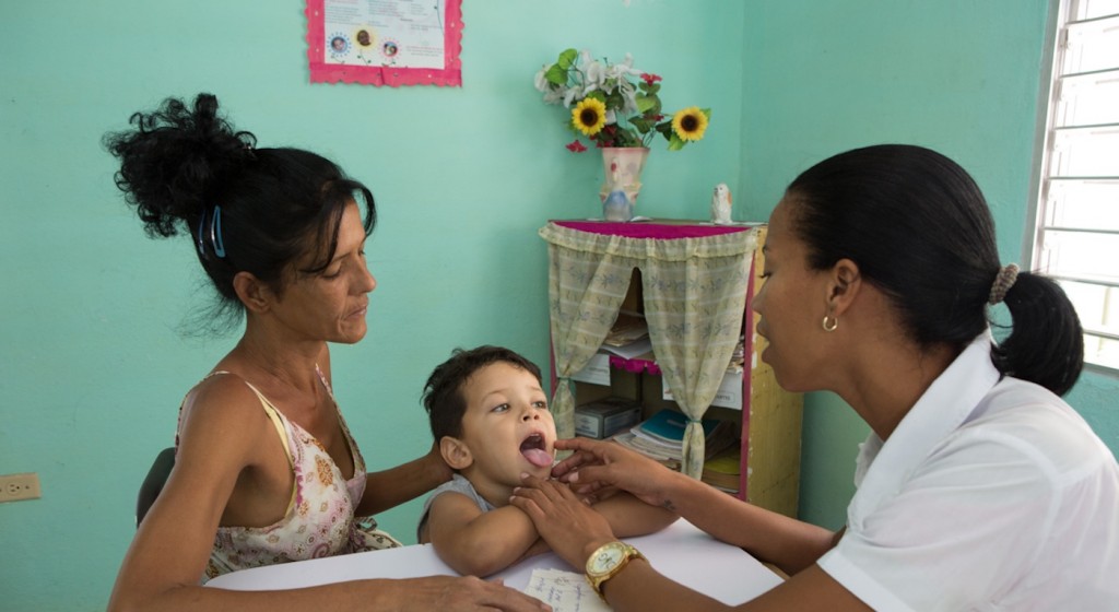 Yarol Yamel, 3, is examined by Dr. Janisleydis Rosado for bronchial asthma at walk-in clinic Number 15, La Santa Fe, Isle of Youth.